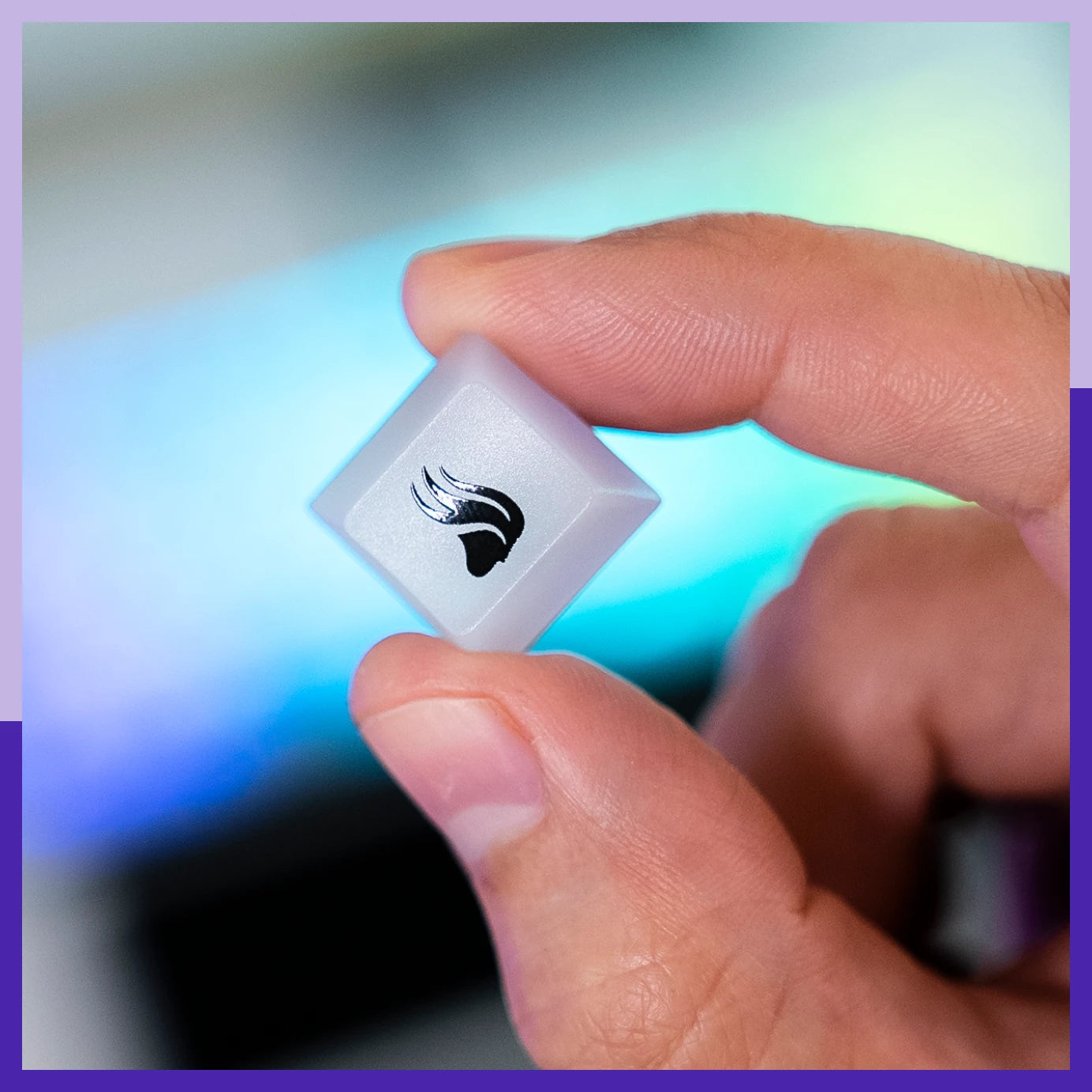 Close up of Glorious logo keycap from Polychroma RGB Keycaps set